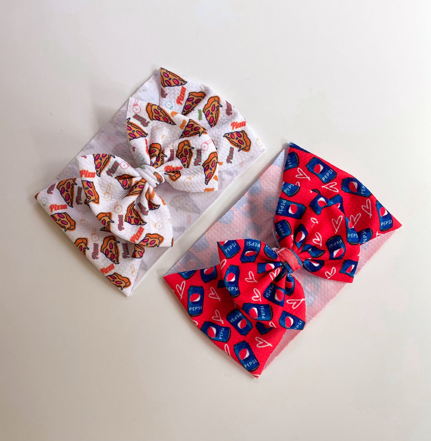 Traditional Bows - Pizza & Pepsi - Ev's Bowtique Shop The most comfortable trendy bows for all of your babes. Traditional bows come styled as headwraps, Nylons, clips or pigtail sets! The choice is always yours!